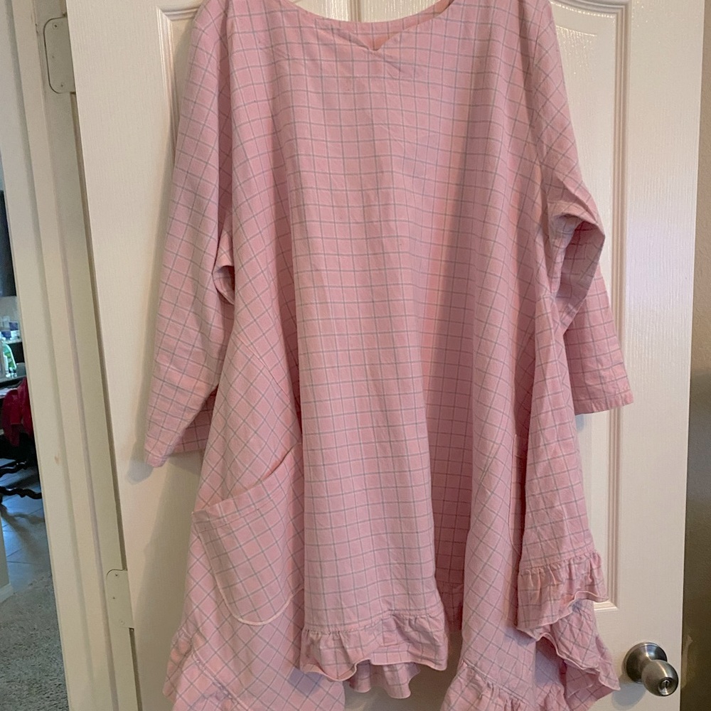 Hearts Desire Plus 1x sized pullover tunic with ruffles along the uneven hem.